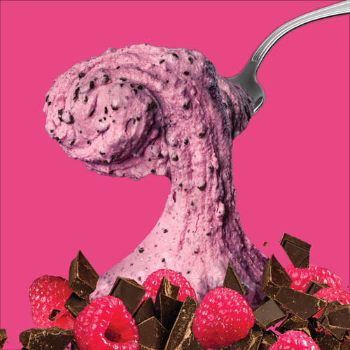 Pink ice cream with raspberries and chocolate on a pink background